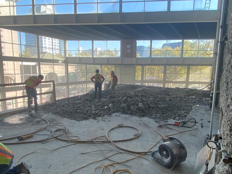 workers doing demo work at theater