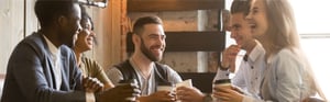 group of young professionals enjoying coffee