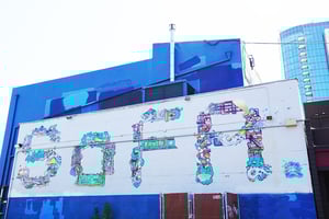 SOFA mural on side of building
